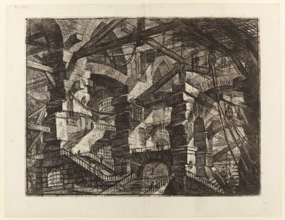 Tiny figures lost in Piranesi's impossible prison of arches and stairs—architecture so vast and self-referential that individual optimization becomes meaningless.